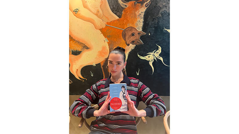 Dua Lipa book club July: Dua holds a copy of Pachinko by Min Jin Lee